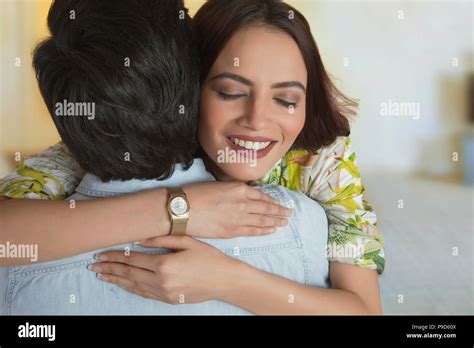 Young Woman Embracing Her Boyfriend Stock Photo Alamy