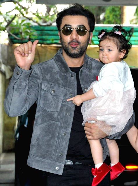 Actors Ranbir Kapoor And Alia Bhatt With Their Daughter Raha