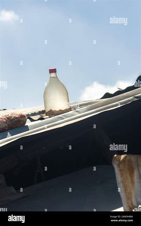 Corrugated Shack Roof With Solar Clear Plastic Water Bottle Filled