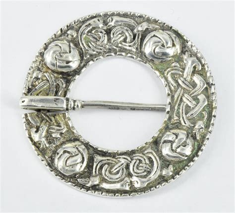 A Scottish Silver Plaid Brooch Round With Celtic Pattern By