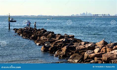 People Fishing On The Breakwall Editorial Image Image Of Horizon