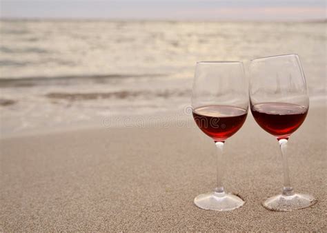 Wine Glasses With Red Wine On The Beach At Sunset Stock Image Image Of Coast Dawn 158935177