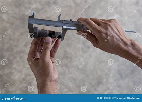 Using Vernier Caliper To Measure Dimensions Of Bolt Royalty Free Stock