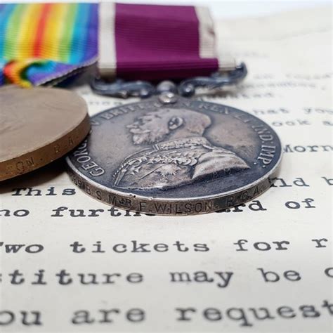 A Group Of Three Medals Comprising A Wwi Pair Awarded To Wo Cl