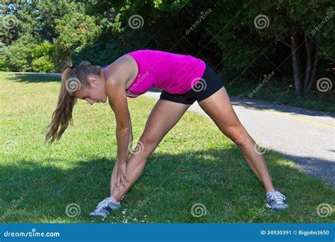 Fit Woman Stretching Her Muscles Before Running Stock Image Image Of