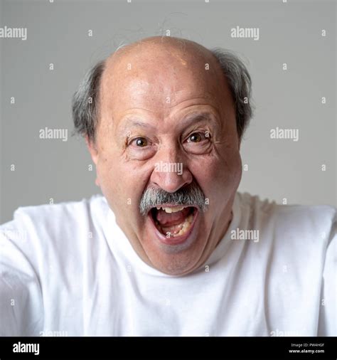 Portrait Of Happy And Cheerful Senior Mature Man Smiling And Excited