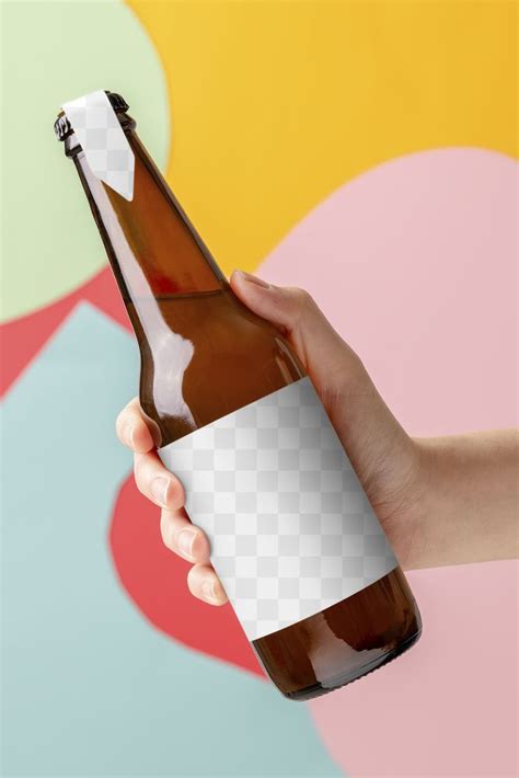 A Person Holding A Beer Bottle With A Blank Label In Their Left Hand