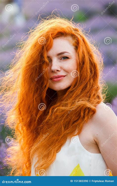 Summer Portrait Of A Beautiful Girl With Long Curly Red Hair Stock