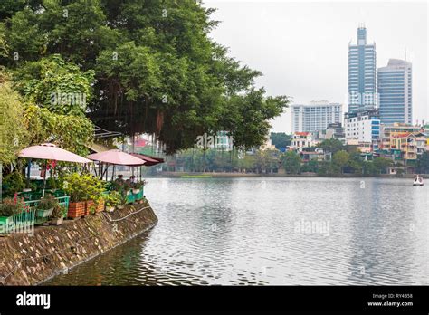 Banh Tom Ho Tay restaurant on the lakeside at Truc Back Lake and the Hanoi skyline, Hanoi ...