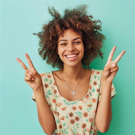 Premium Photo Woman With Curly Hair Is Making A Peace Sign