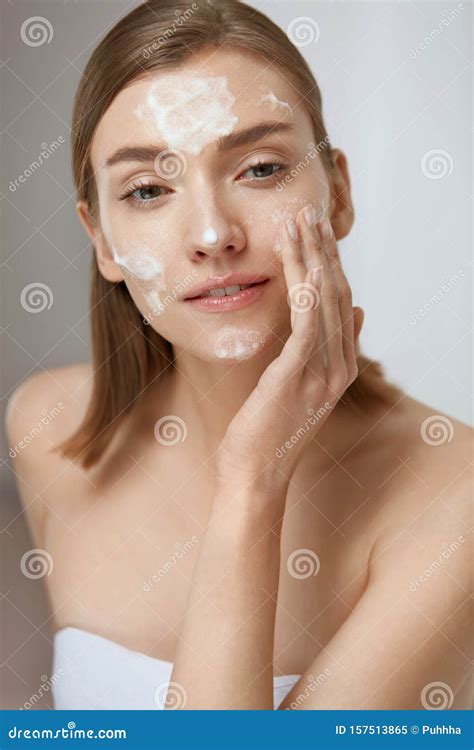 Face Skin Care Woman Applying Facial Cleanser On Face Closeup Stock