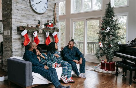 Happy black family enjoying Christmas holidays at home · Free Stock Photo