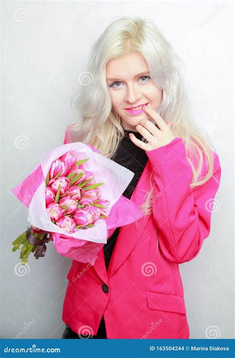 Tender Pretty Blonde Slim Teen Girl With Pink Flowers Cheerful Woman With Fresh Bouquet Stock