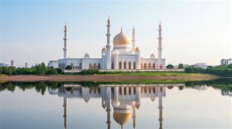 Premium Ai Image A White Mosque With A Golden Dome And The Reflection