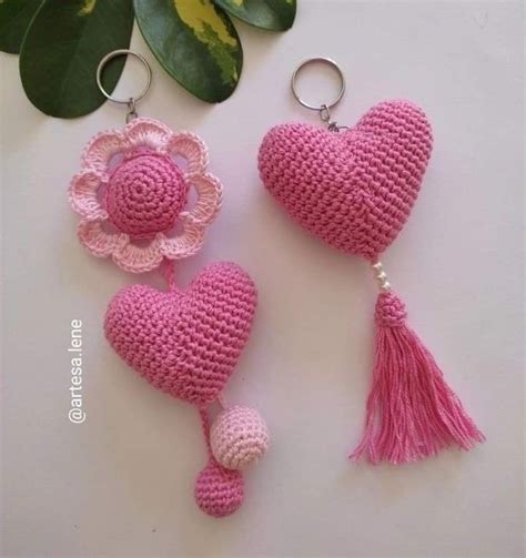 Two Crocheted Heart Shaped Keychains With Tassels And A Flower