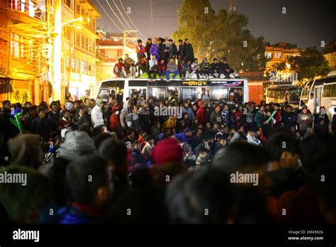 Nepal. 18th Dec, 2022. Nepali football fans watch the final match of