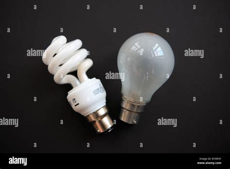 eco light bulb and traditional light bulb Stock Photo - Alamy