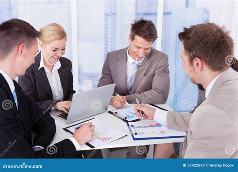 Business People Discussing At Table In Office Stock Image Image Of