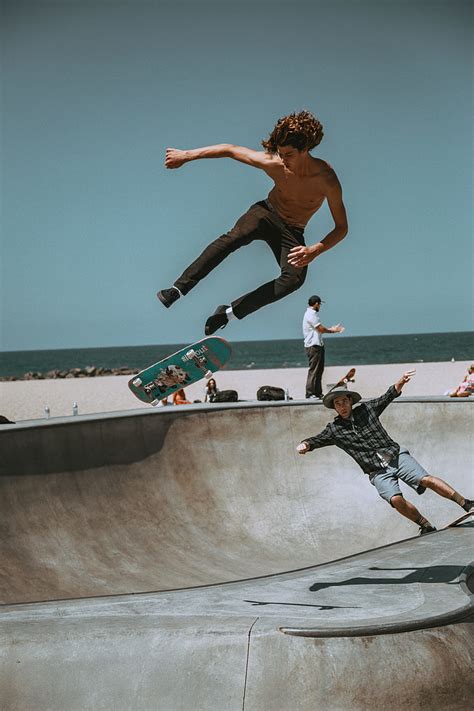 Royalty Free Photo Topless Man Using Skateboard Near Beach Under Clear