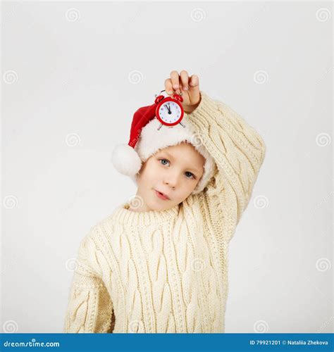 Little Boy Wearing Santa Hat Against White Background Stock Image