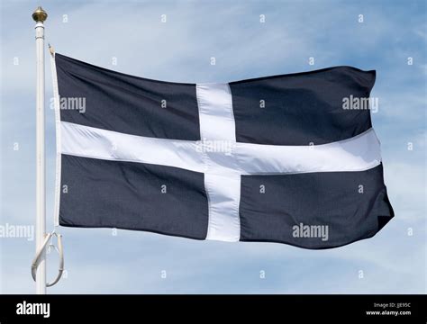 Cornish black and white cross flag of St Piran unfurled Stock Photo - Alamy