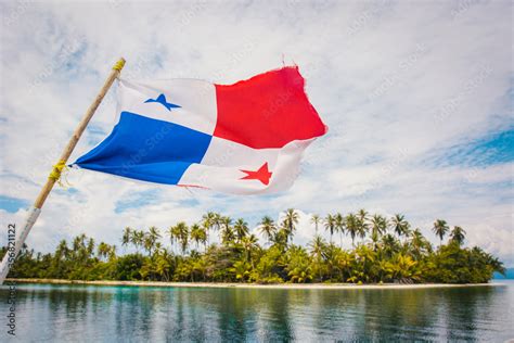 Panamanian Flag Waving On A Wooden Pole With Paradise Island In