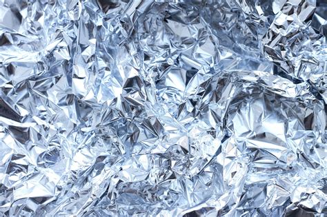 Premium Photo Abstract Crumpled Silver Aluminum Foil Close Up