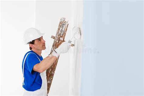 Painter Painting A Wall With Paint Roller Stock Image Image Of