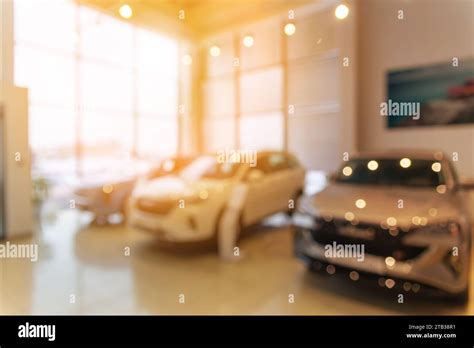 Blurred New Car Parked In Modern Showroom Waiting For Sales Abstract