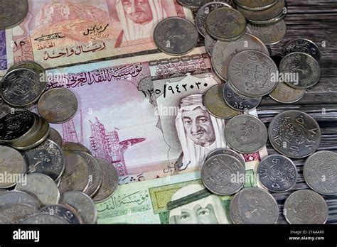 Saudi Arabia riyals money banknote bills and coins of different eras ...