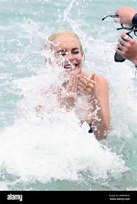 Troubled American Starlet Lindsay Lohan Enjoys A Dip In The Warm Ocean