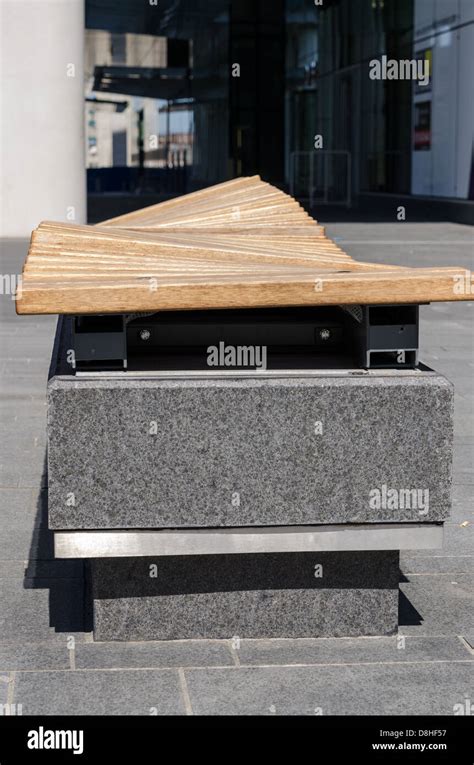 Curved Wooden Bench Seat Mounted On Granite Plinth At One Snowhill