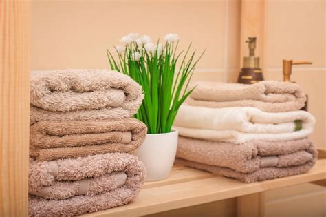 Premium Photo Clean Towels On Shelf In Bathroom