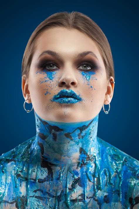 Creative Blue Makeup and Body Art on a Blue Background. Stock Image ...