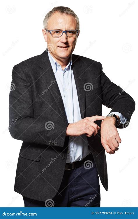 Late Again Studio Portrait Of A Mature Businessman Pointing To His