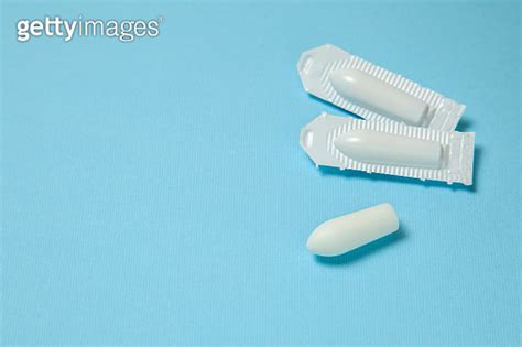 Suppository For Anal Or Vaginal Use On A Blue Background Candles For