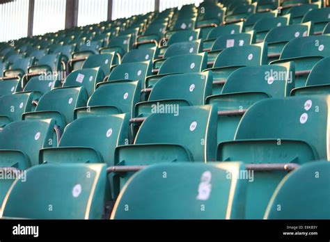 Empty Green Grandstand Seating In A Regular Symmetrical Pattern Stock