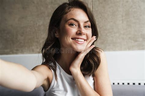 Image Of Beautiful Joyful Woman Smiling While Taking Selfie Photo Stock