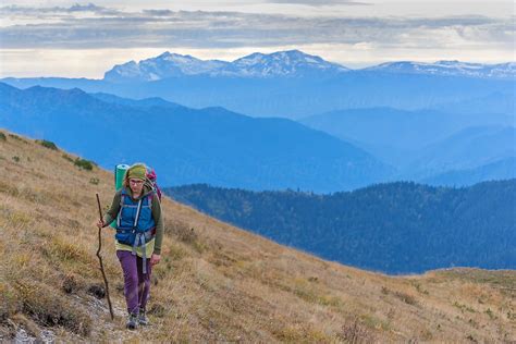 A Women Walking Mountain Path By Stocksy Contributor Sasha Evory