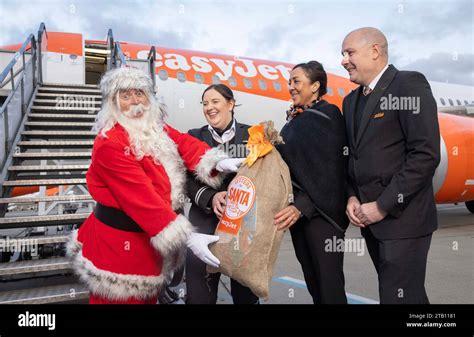 Editorial Use Only Left To Right Father Christmas With Easyjet Pilot