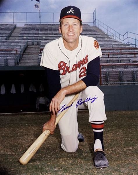 The Baseball Player Is Posing With His Bat