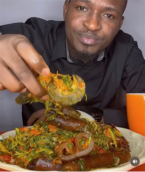 Pounded Yam Served With Efo Riro Smoked Fish Ponmo And Snail