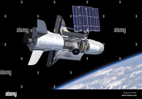 Artist's concept of the NASA X-37B spacecraft in orbit, showing payload ...