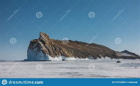 A Picturesque Rock Island In The Middle Of A Frozen Lake Stock Image Image Of Scenic