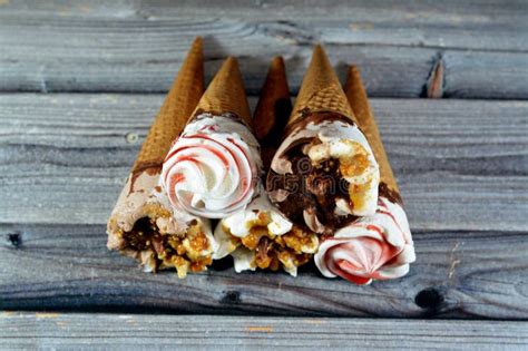 Ice Cream Vanilla And Chocolate Cones With Topping Of Chocolate And