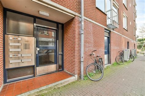 Premium Photo Two Bikes Parked Outside Of A Brick Building