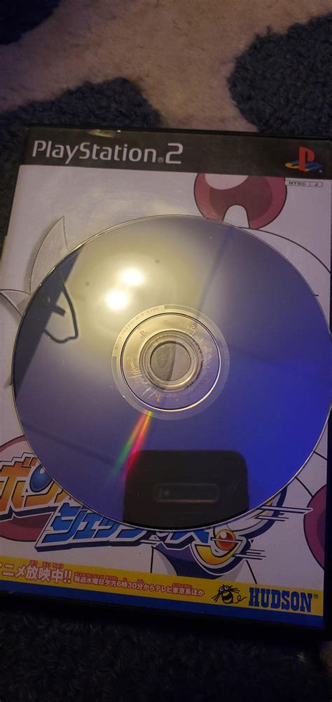 PS2 Slim SCPH-70012 making clicking sounds and stuck on "reading disc