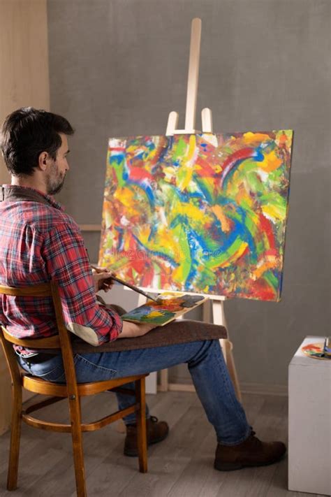 Male Artist Working On Painting Man Artist Painter In Creative Studio