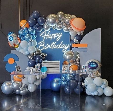 An Image Of A Birthday Party Setting With Balloons On The Wall And