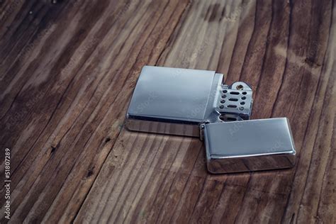 Зажигалка на фоне из дерева Stock Photo | Adobe Stock